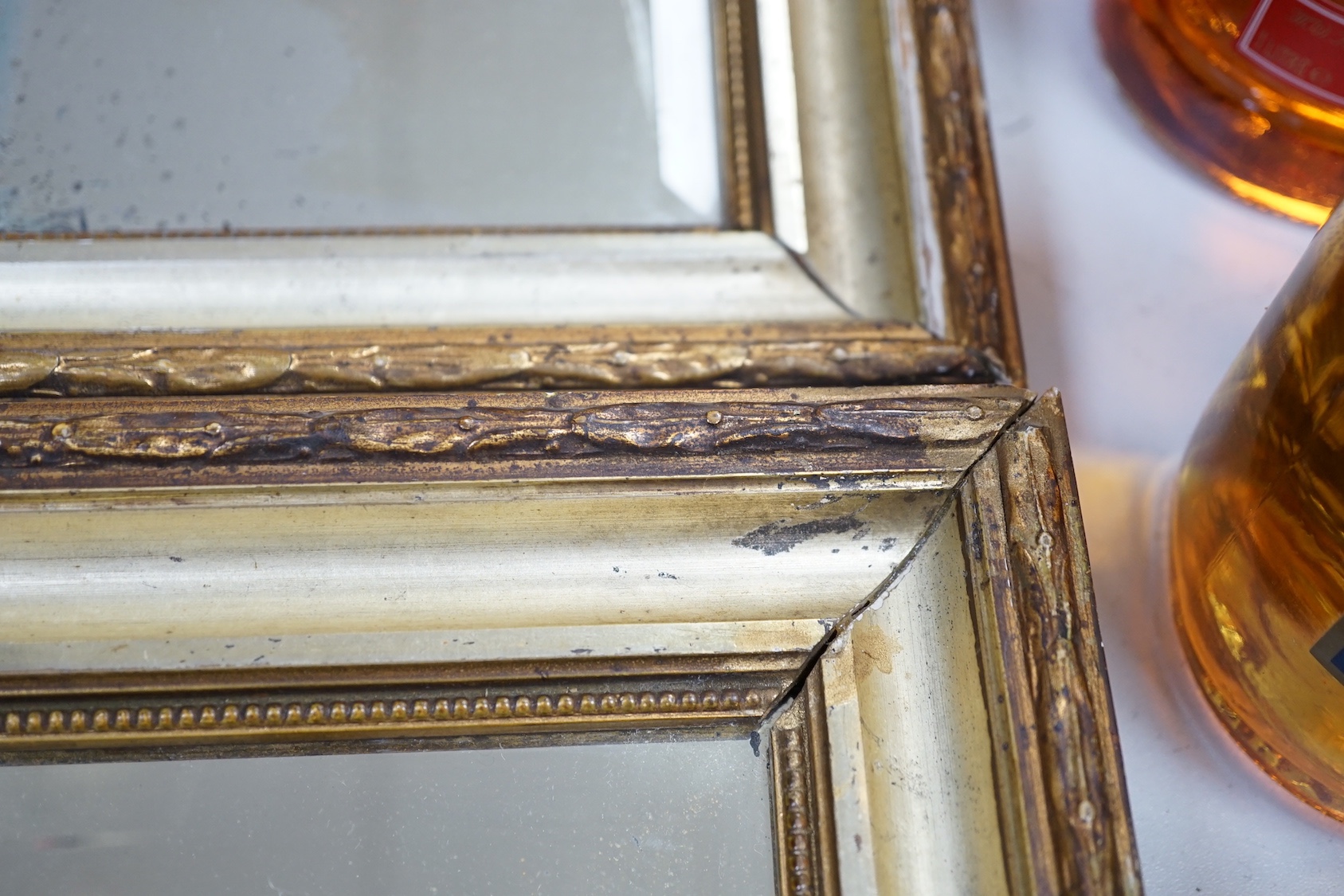 A pair of squared bevelled wall mirrors (2) 29cm sq including frames